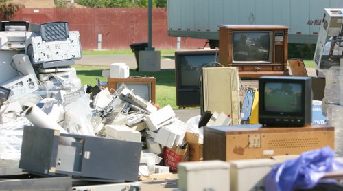 Workers managing builders waste clearance